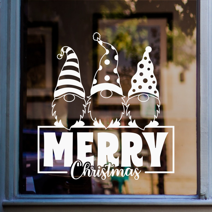 White Merry Christmas gnome window sticker featuring three festive gnomes with patterned Christmas hats displayed on glass.
