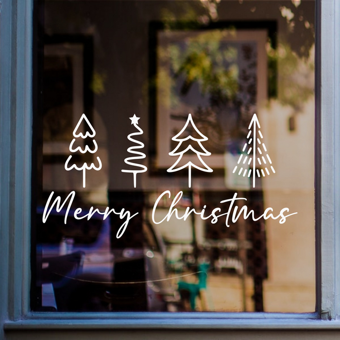 White Merry Christmas window sticker with four minimalist Christmas tree drawings displayed on a shop window