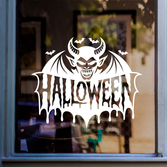 Devil Face & Bat Wings Halloween Window Sticker: white vinyl design on a blue-framed glass door