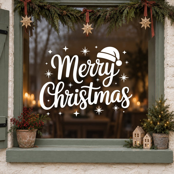 Merry Christmas Santa Hat Window Sticker in white on a sage green framed window decorated for Christmas
