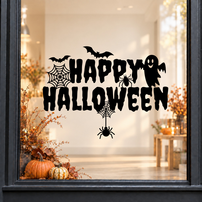 Ghost & Spider Happy Halloween window sticker showing Happy Halloween lettering with a ghost, spiderweb and hanging spider, black vinyl on a light shop window with a dark charcoal frame