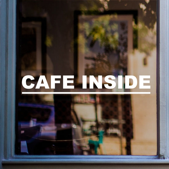 Café Inside Window Sticker displayed on a window