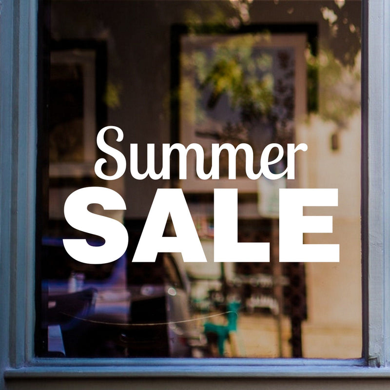 Summer Sale shop window sticker displayed on a shopfront window