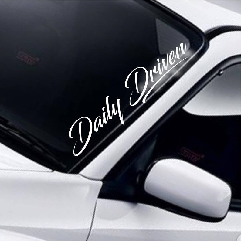 Daily Driven vinyl windscreen sticker fitted to a car