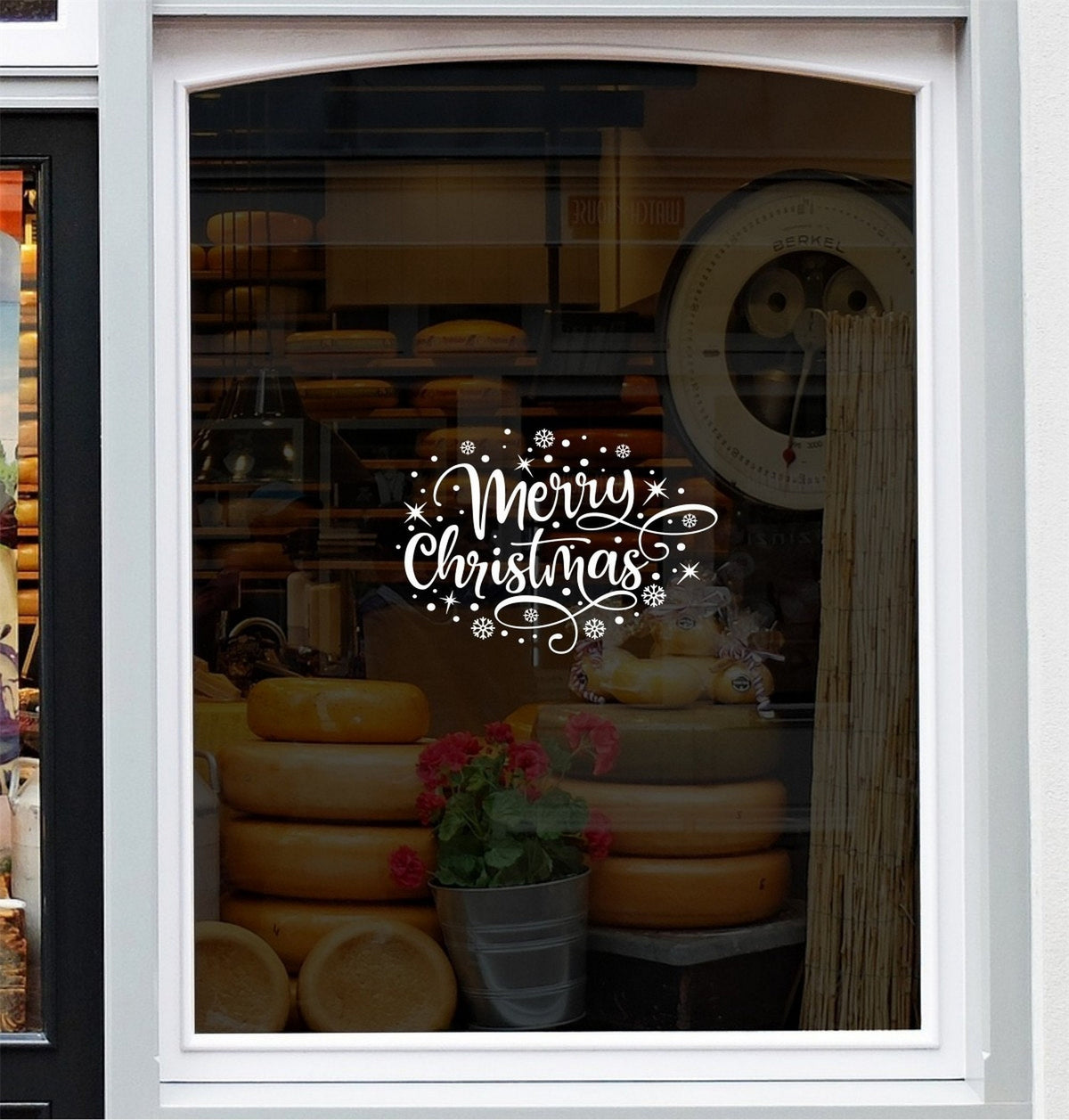 Merry Christmas snowflake vinyl sticker shown on a shop window mockup