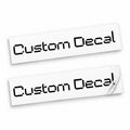 Two matching black Custom Decal vinyl stickers in angular retro digital lettering on backing sheets against white.