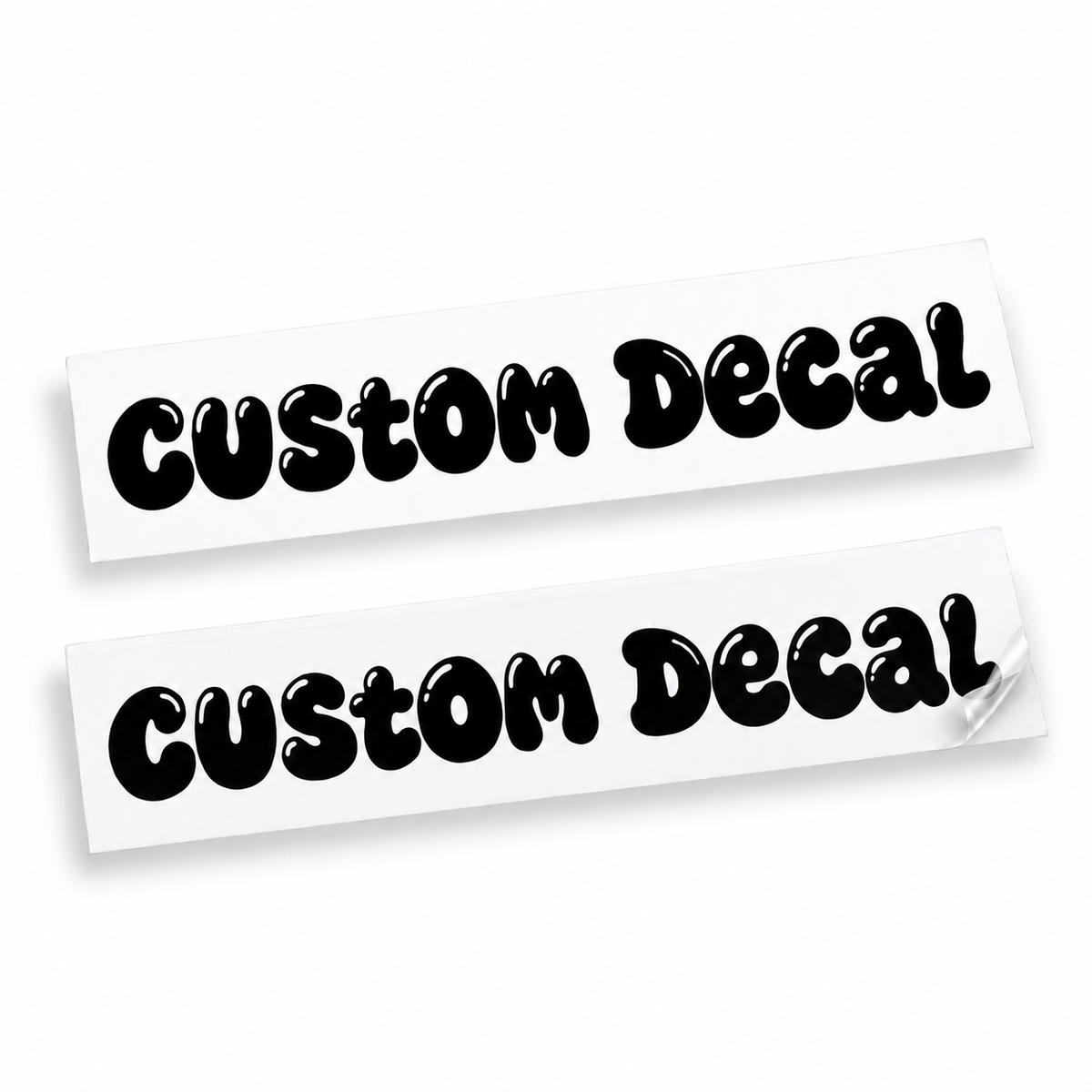 Two matching black custom text vinyl decals in rounded bubble lettering with cut-out details on backing sheets against white.