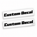Two matching black Custom Decal vinyl stickers in bold slanted angular lettering on backing sheets against white.