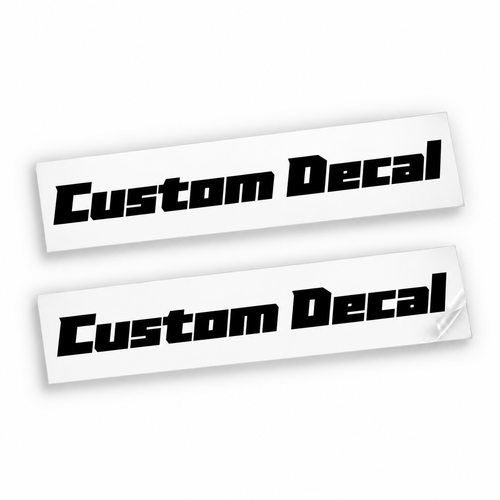 Two matching black Custom Decal vinyl stickers in bold slanted angular lettering on backing sheets against white.