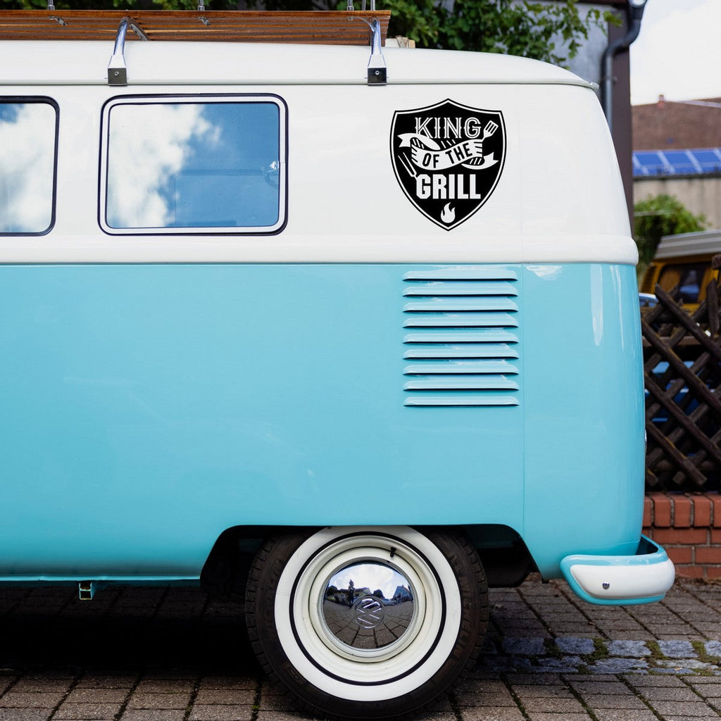 King Of The Grill caravan sticker shown on a blue campervan