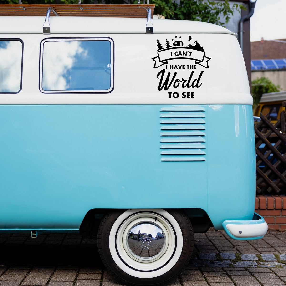 I Can't, I Have The World To See caravan sticker shown on a blue campervan