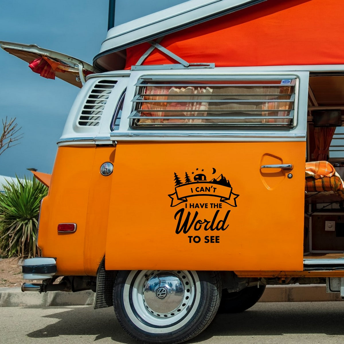 I Can't, I Have The World To See caravan sticker shown on an orange campervan