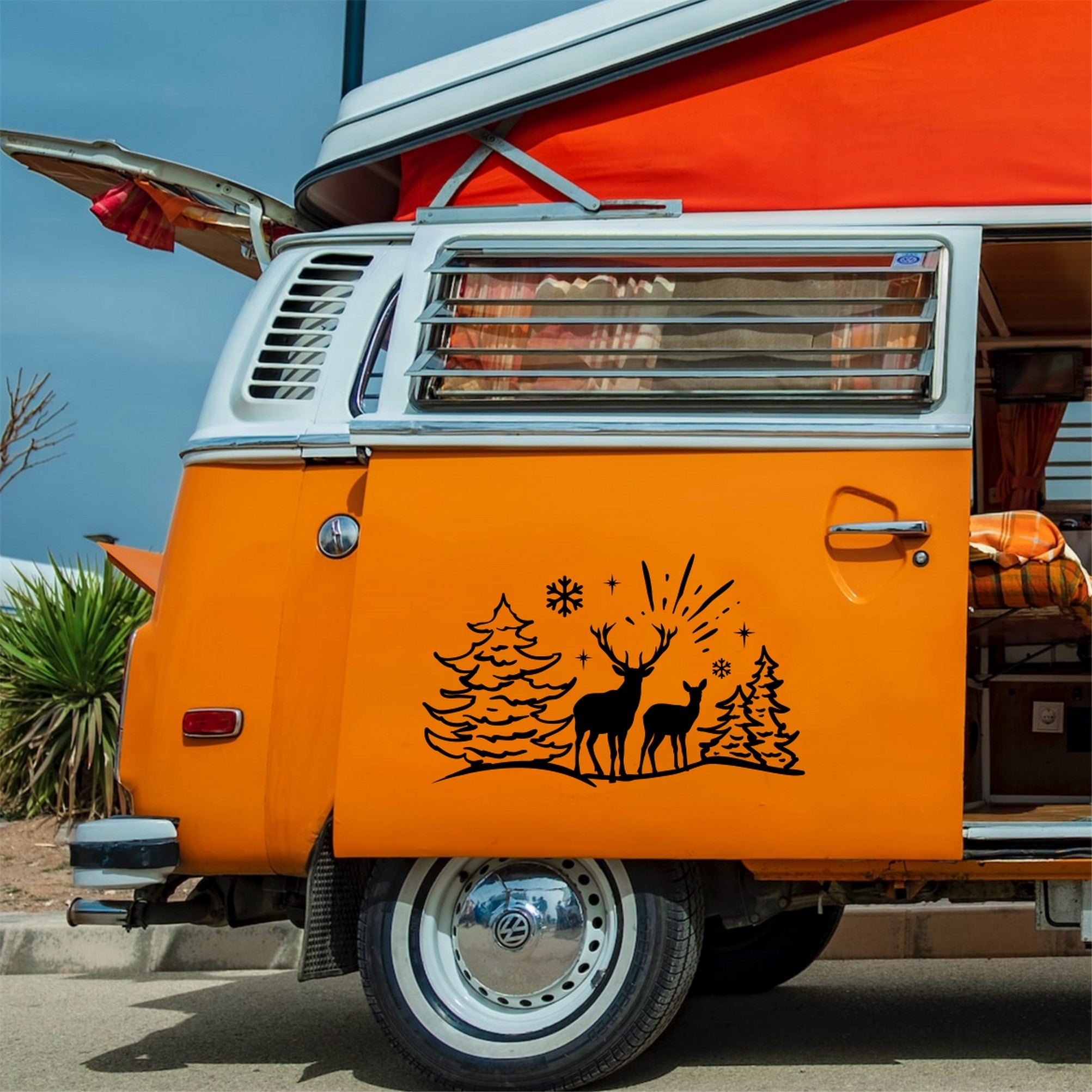 Deer Winter Scene caravan sticker shown on an orange campervan