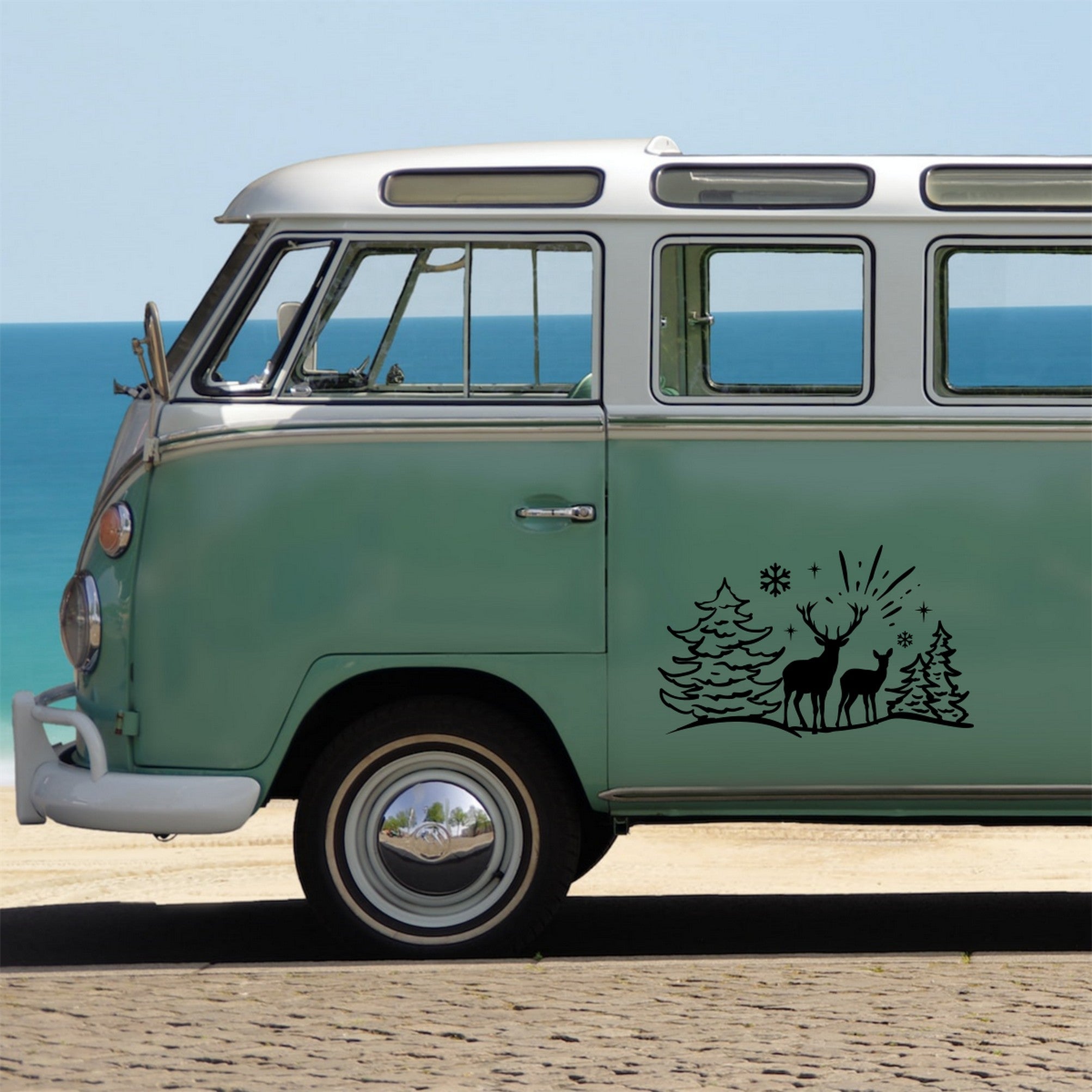 Deer Winter Scene caravan sticker shown on a green campervan