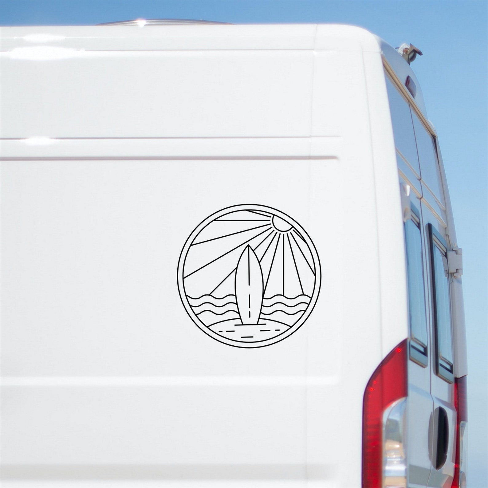 Sunrise surfing beach caravan sticker shown on a van