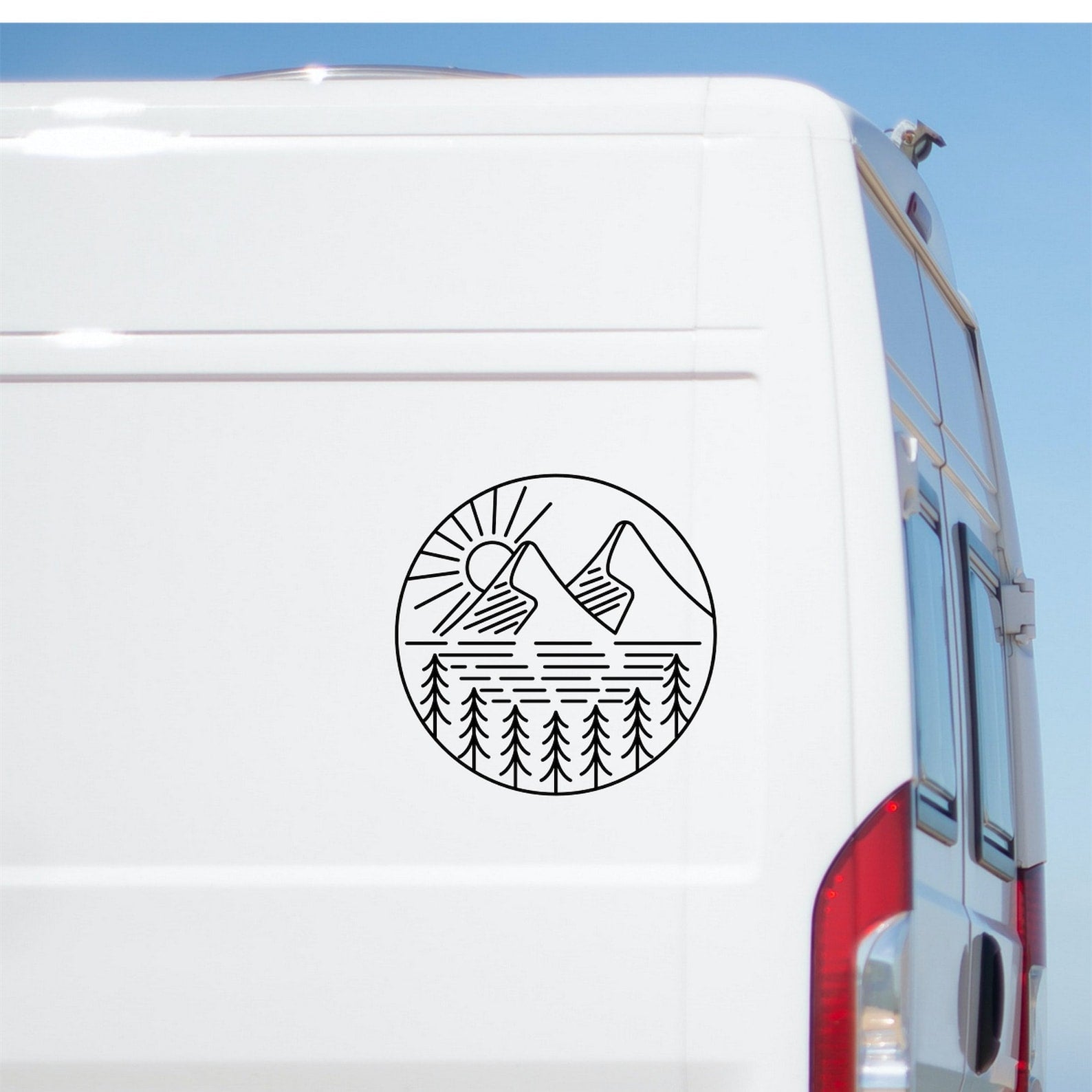 Mountain landscape scene caravan sticker shown on a van