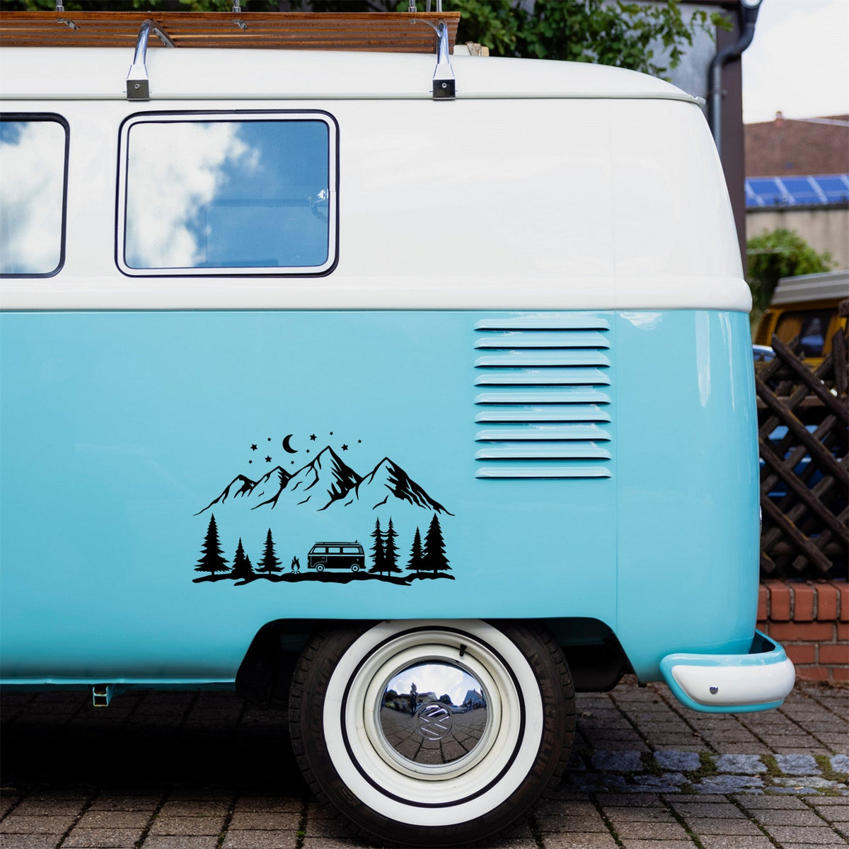 Camper Trailer Mountain caravan sticker shown on a blue campervan