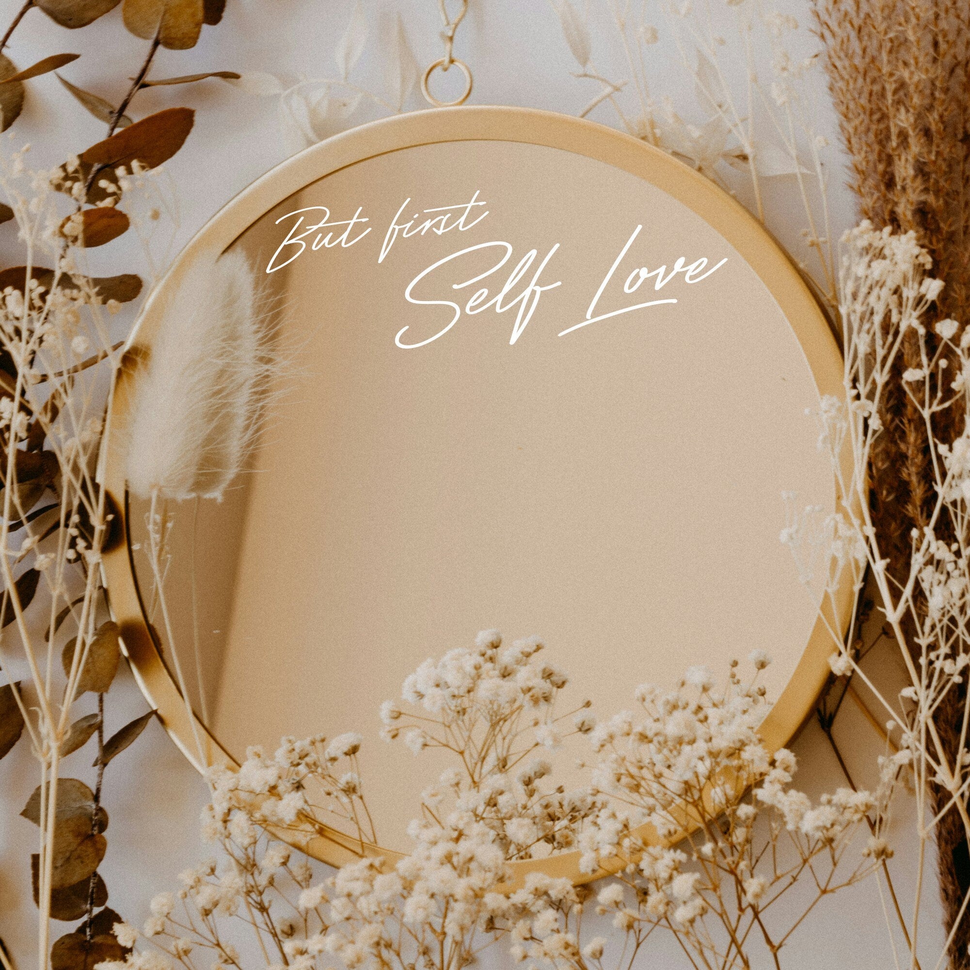 White “But First Self Love” vinyl sticker on a round mirror with dried flowers