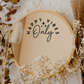 Black “Happy Vibes Only” vinyl sticker on a round mirror with dried flowers