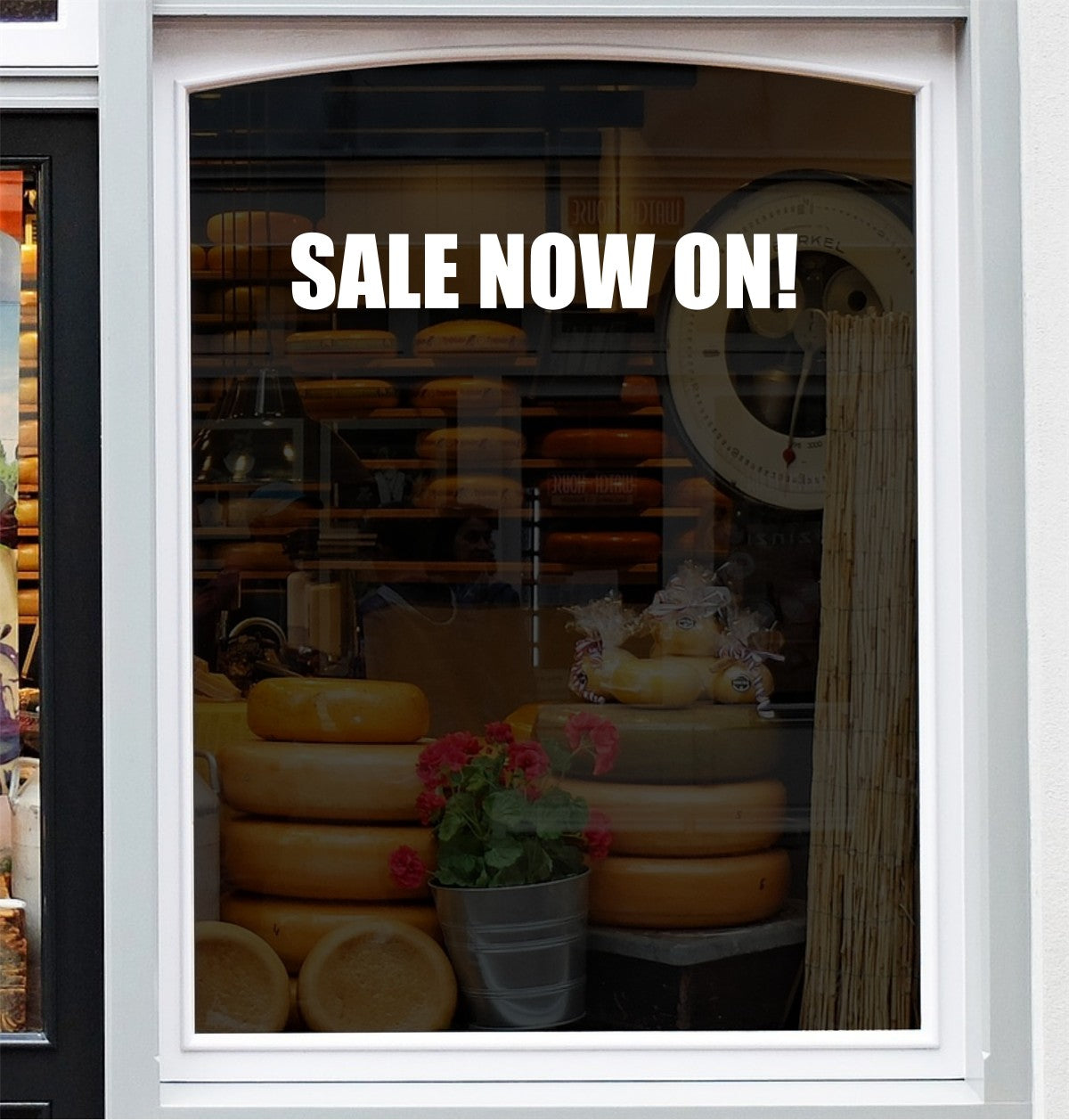 Sale Now On vinyl window sticker displayed across a shop window