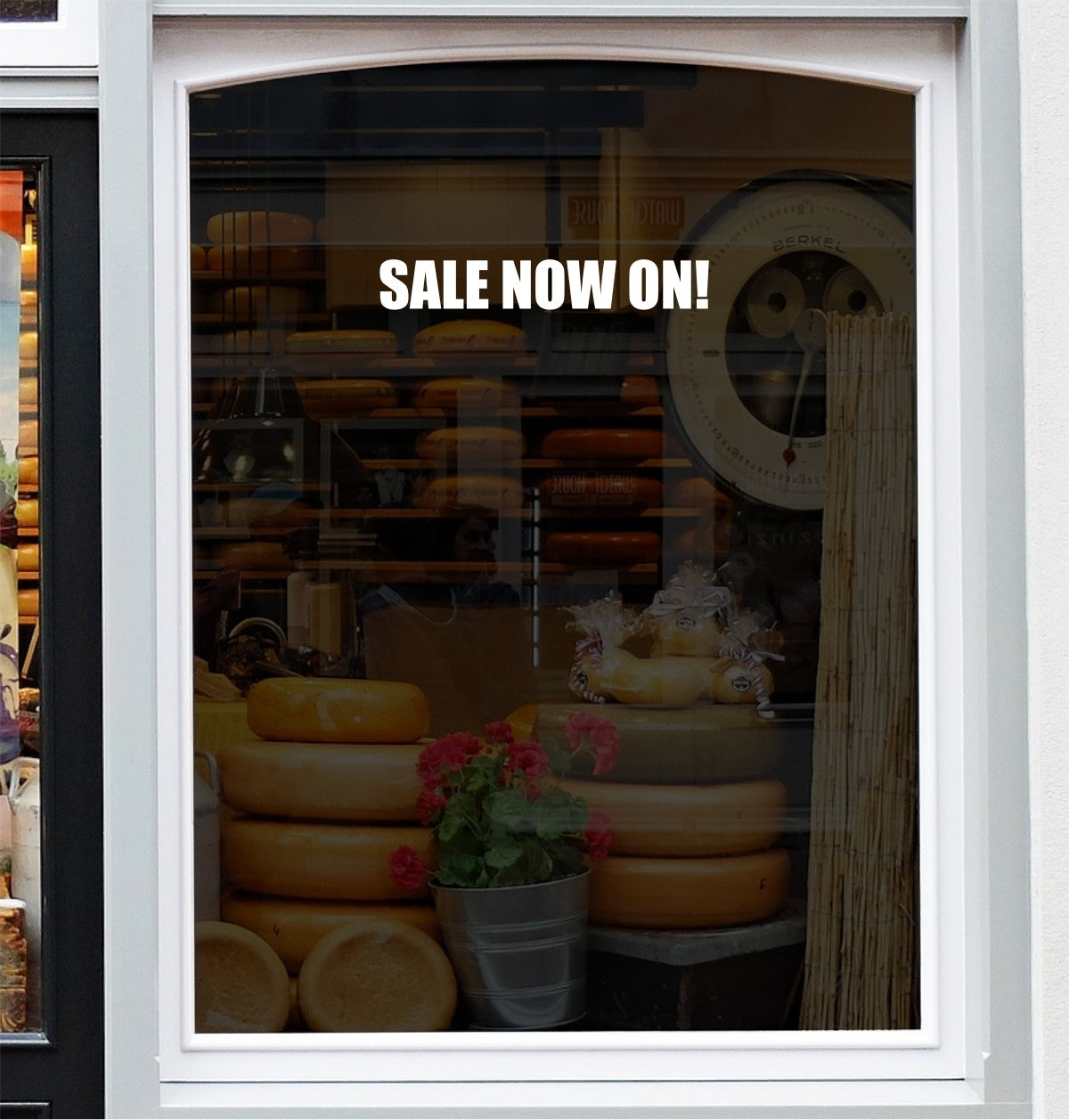 Smaller Sale Now On vinyl lettering applied to a shop window