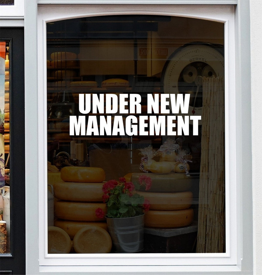 Under New Management Shop Window Sticker shown in a shop window display