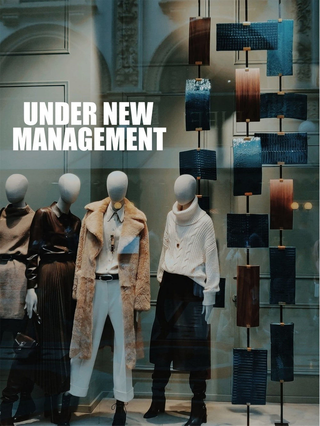 Under New Management Shop Window Sticker shown in an alternative retail window setting