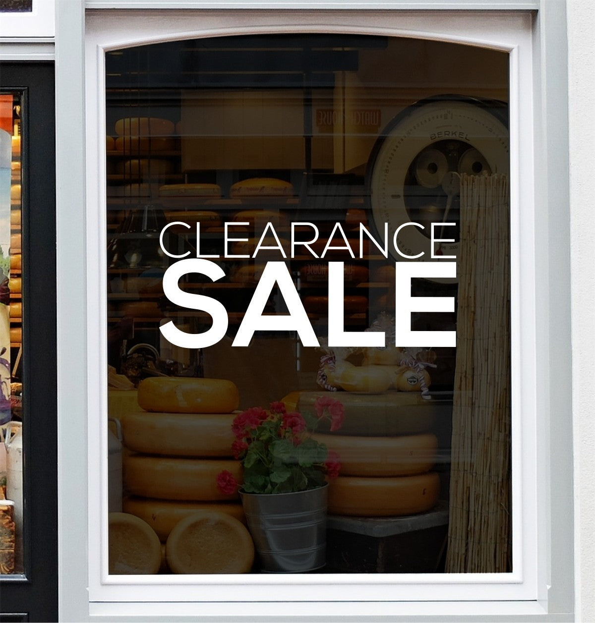 White Clearance Sale vinyl decal displayed on a shop window