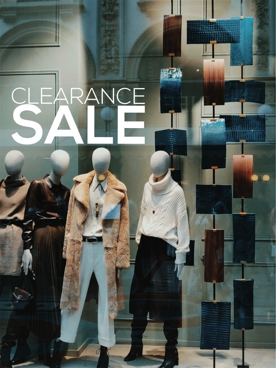 Large white Clearance Sale vinyl sticker on a fashion retail window
