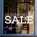 Closing Down Sale Shop Window Sticker shown on a shop window