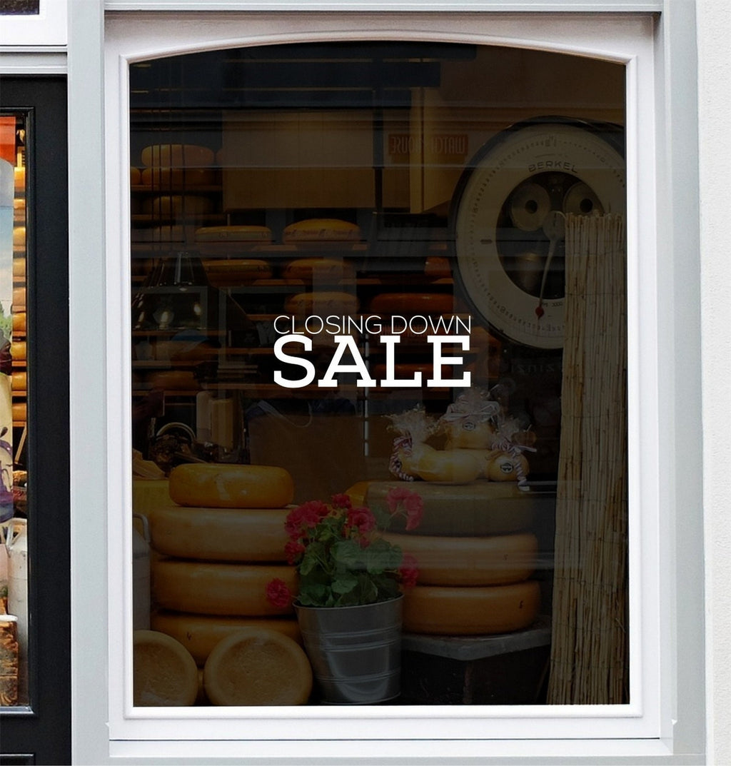 Closing Down Sale Shop Window Sticker displayed on a storefront glass pane
