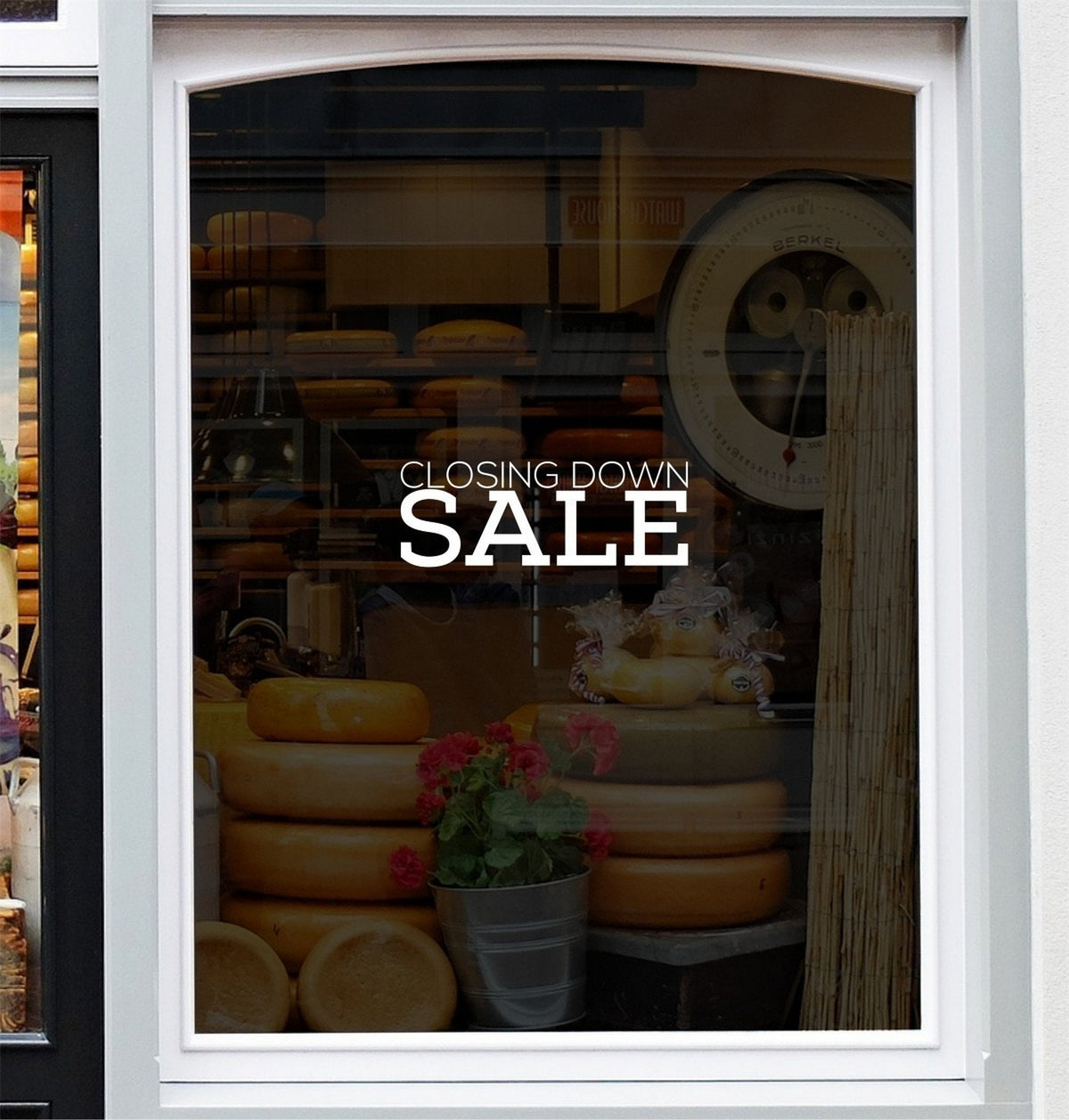 Closing Down Sale Shop Window Sticker displayed on a storefront glass pane