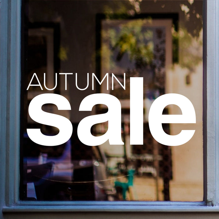 Autumn Sale Shop Window Sticker shown on a blue-framed shop window