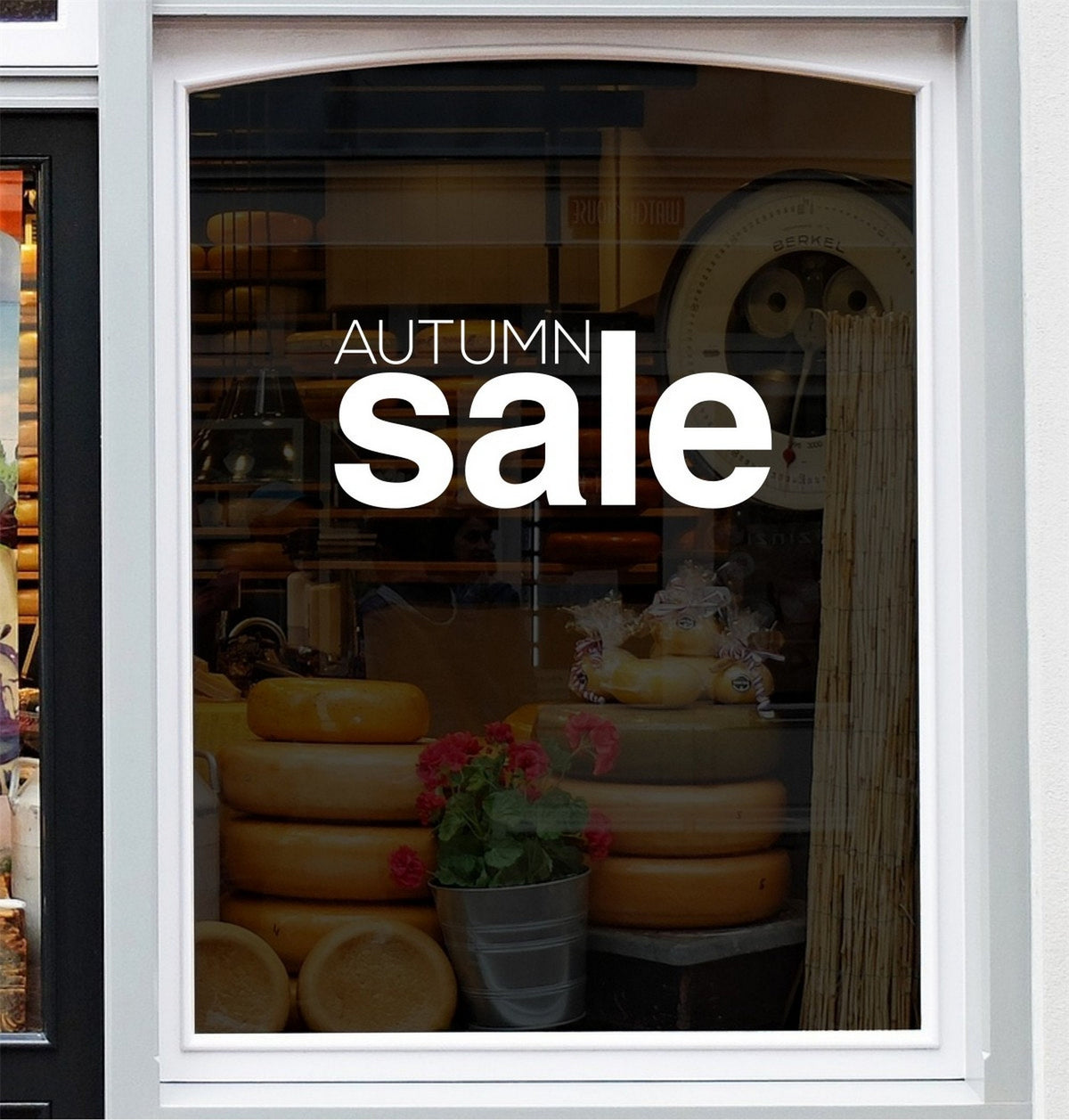 Autumn Sale Shop Window Sticker displayed on a storefront glass pane