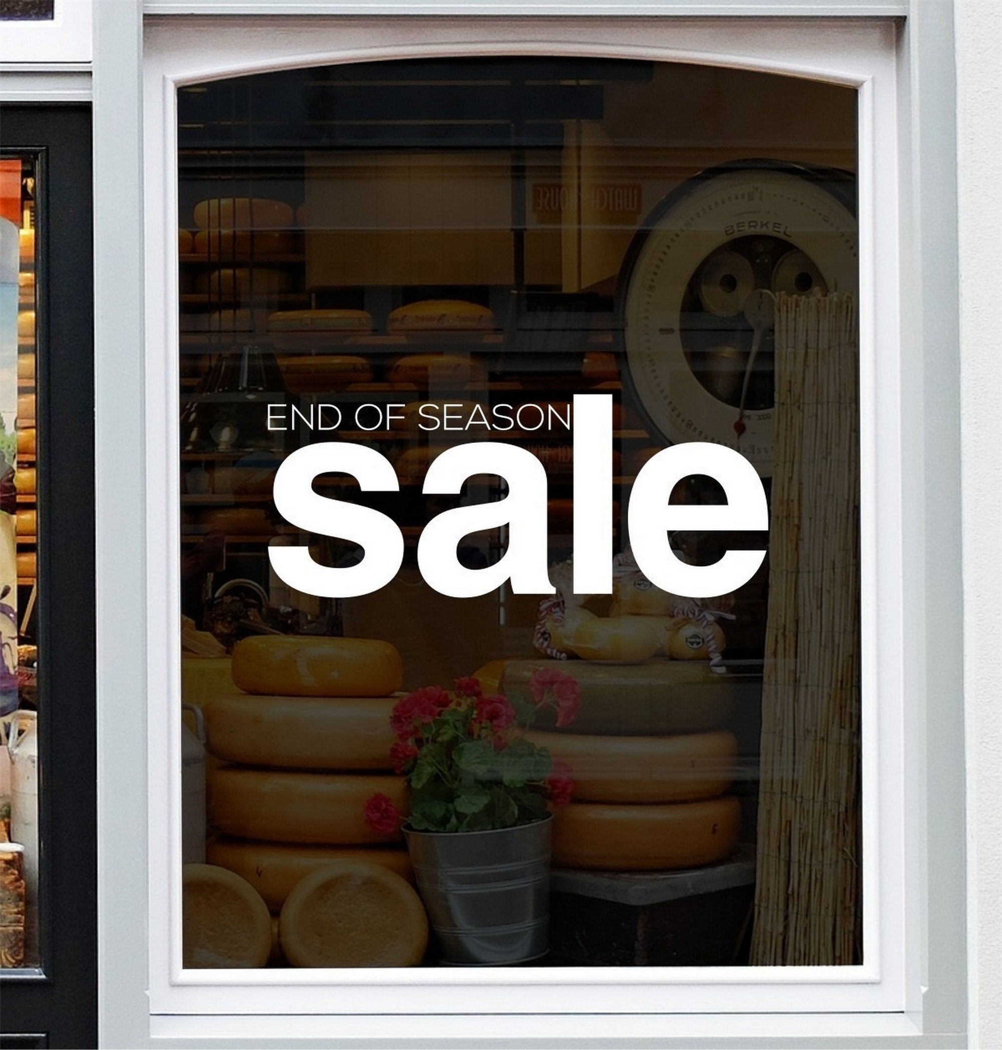 End of Season Sale Shop Window Sticker shown in a shop window display