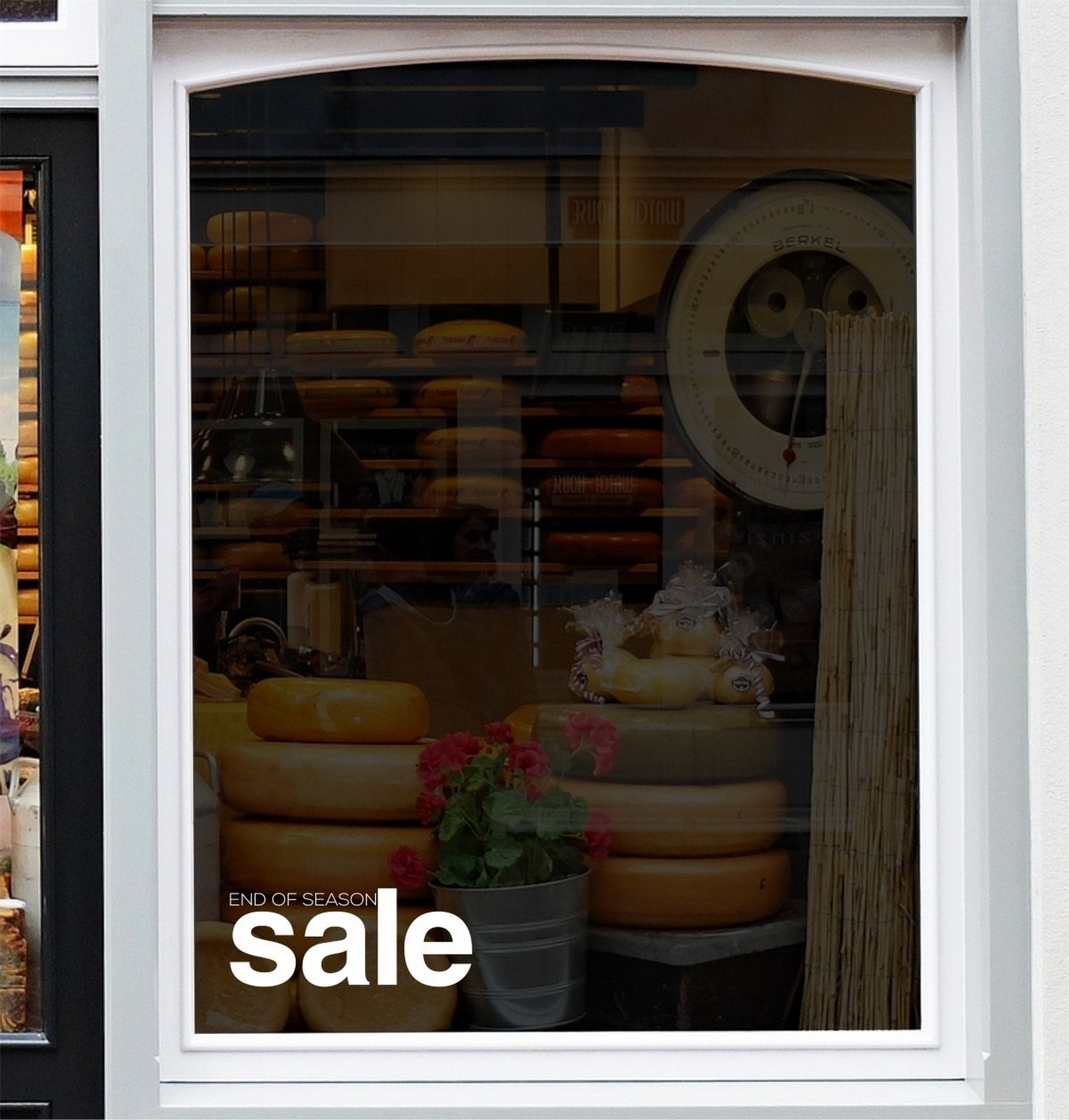 End of Season Sale Shop Window Sticker displayed on a storefront glass pane