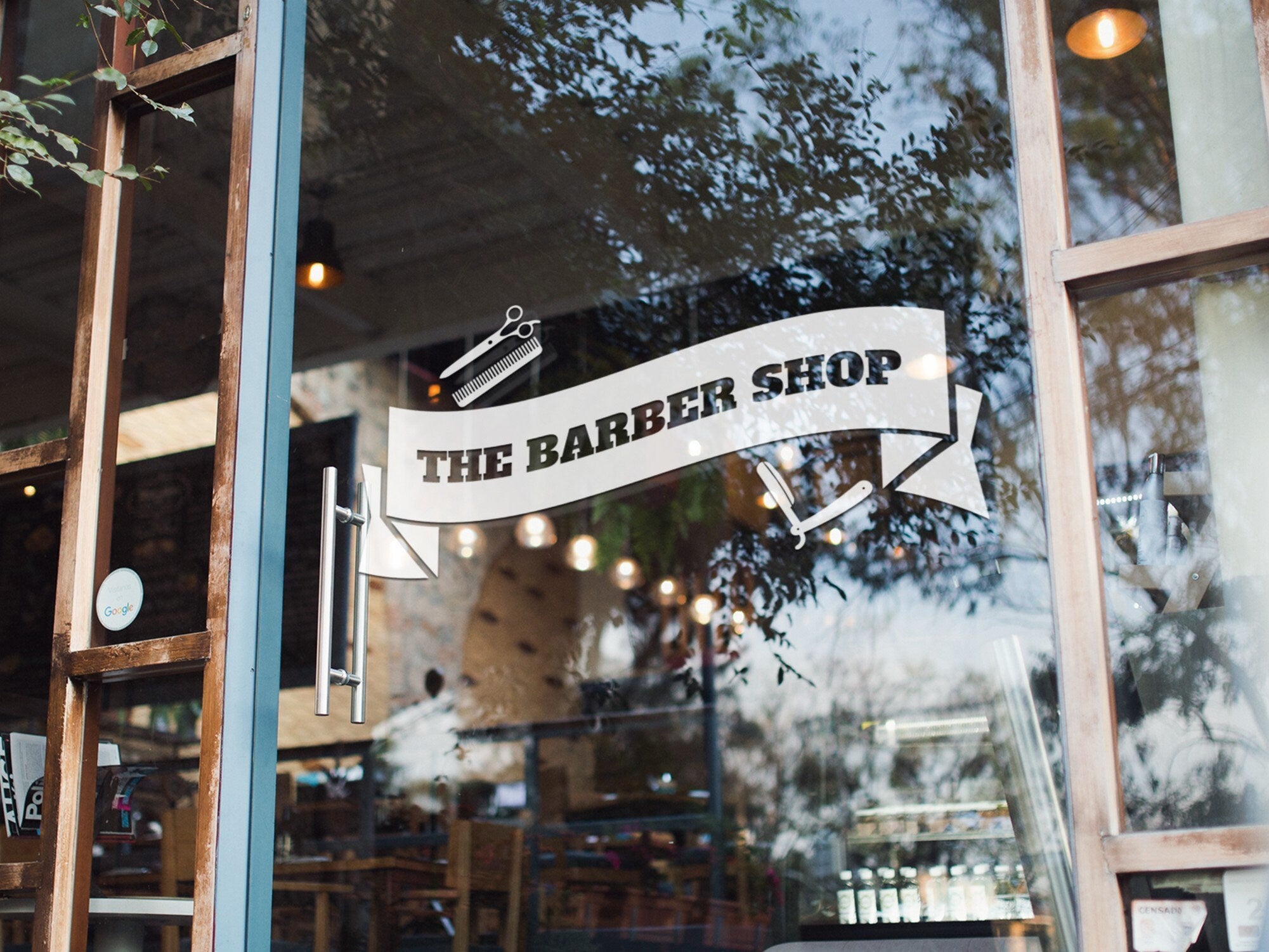 The Barber Shop Banner Window Sticker shown in an alternative retail window setting