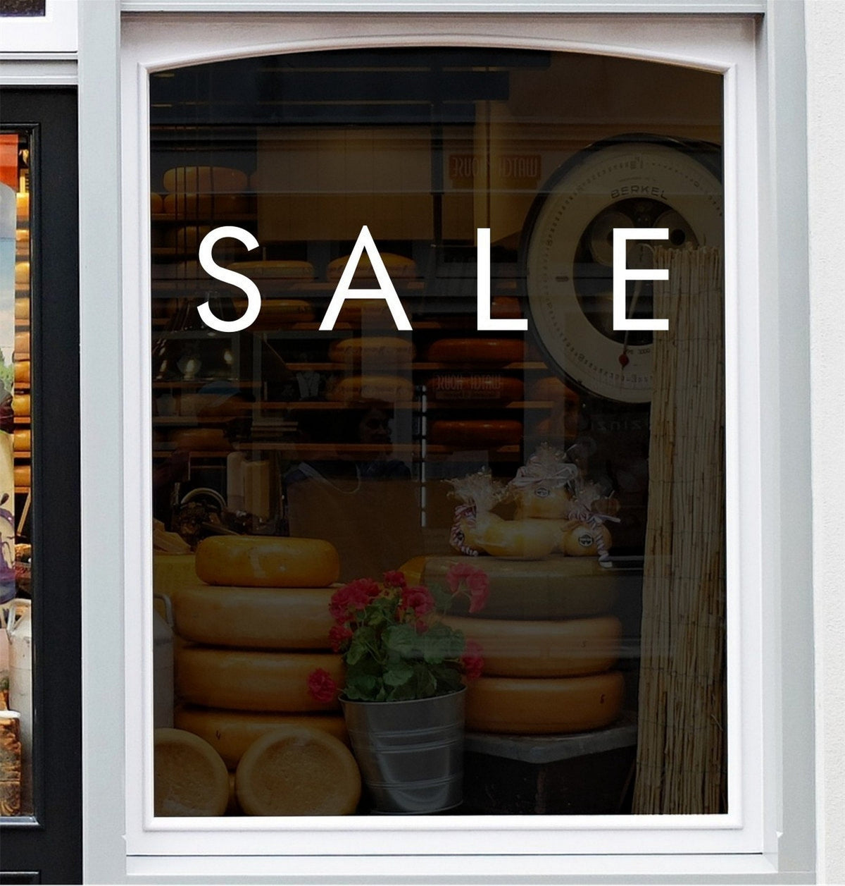 Sale Shop Window Sticker for Retail Displays shown in a shop window display