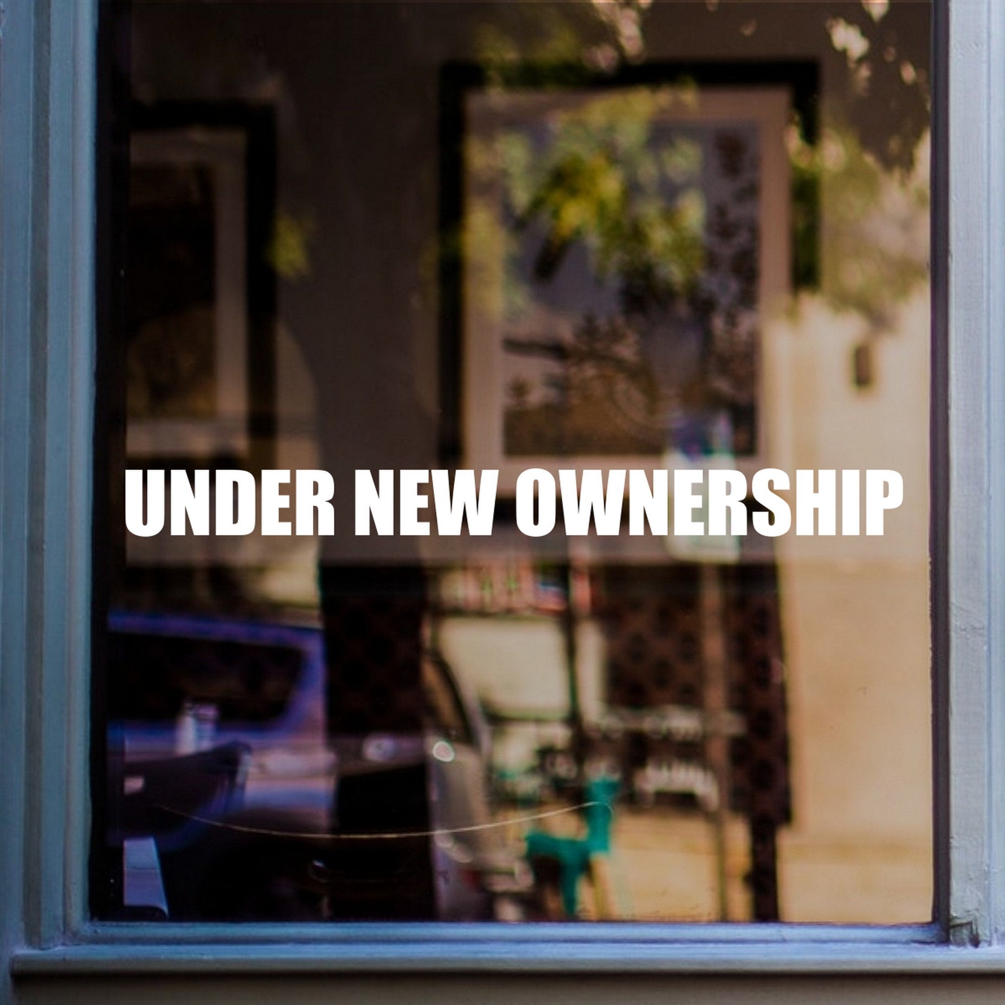 Under New Ownership Shop Window Sticker shown on a shop window