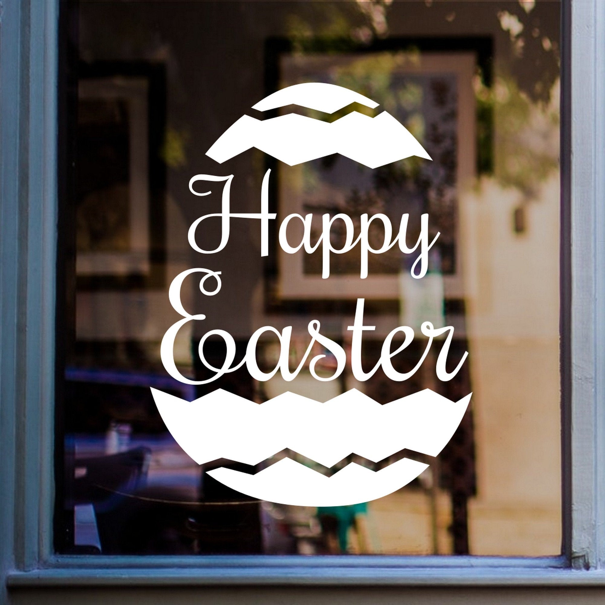 Happy Easter Window Sticker for Seasonal Displays displayed on a shop window