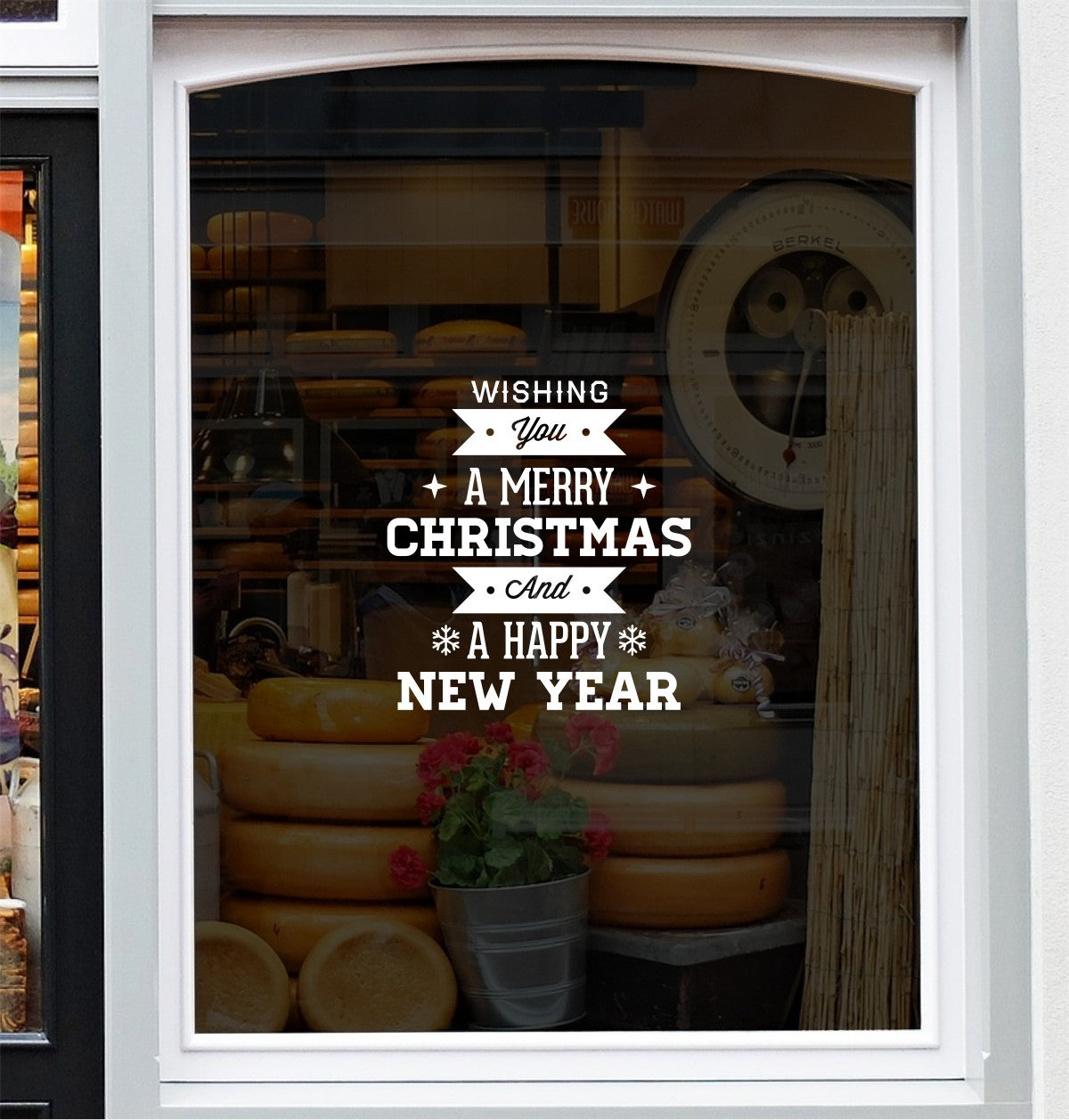 Festive greeting vinyl decal displayed on a retail shop window