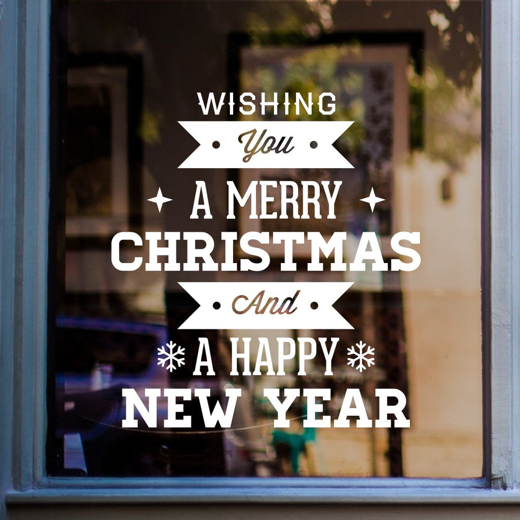 White Wishing You a Merry Christmas and Happy New Year decal on a shop window
