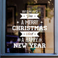 White Wishing You a Merry Christmas and Happy New Year decal on a shop window