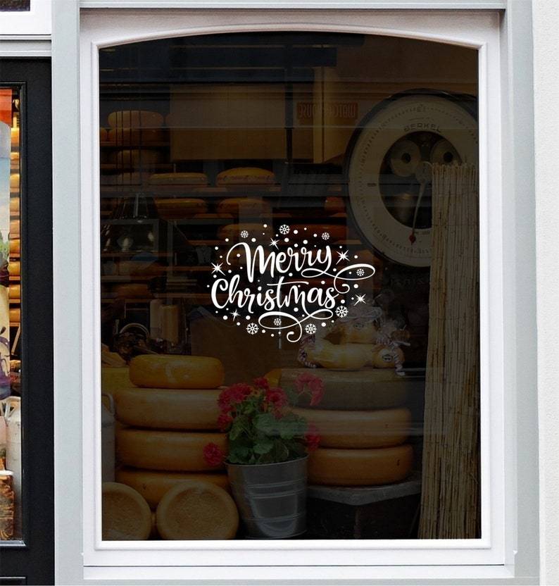 Merry Christmas snowflake vinyl sticker shown on a shop window mockup