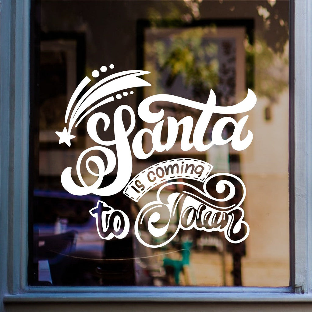 White Santa Is Coming to Town vinyl sticker on a shop window