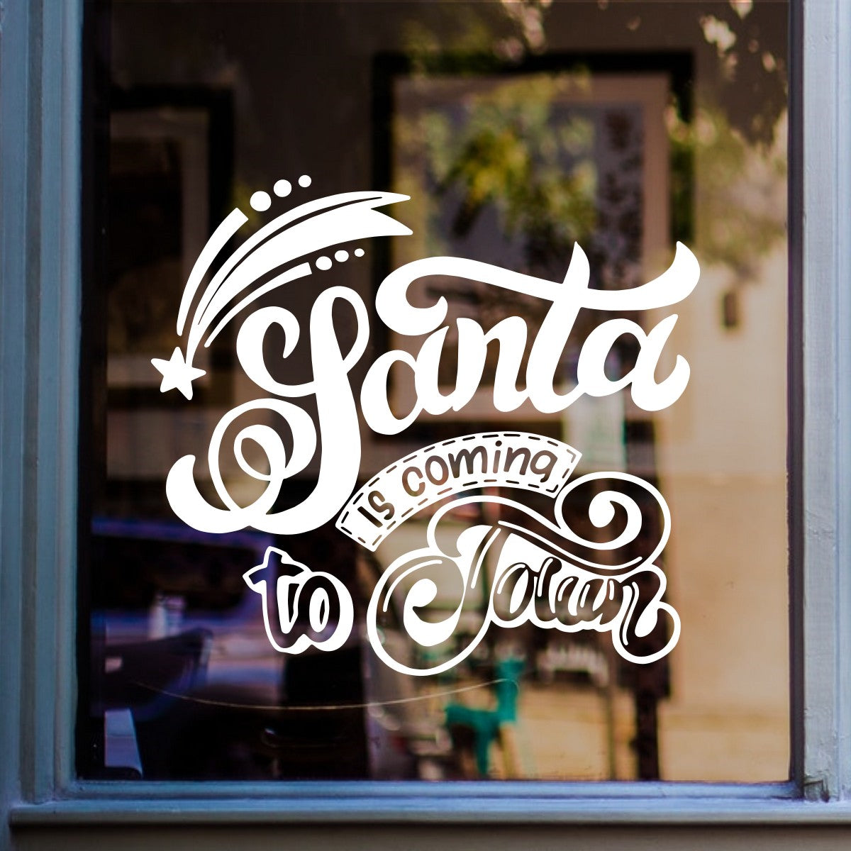 White Santa Is Coming to Town vinyl sticker on a shop window