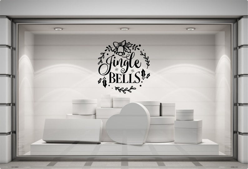 Jingle Bells festive vinyl decal on a modern grey shop display