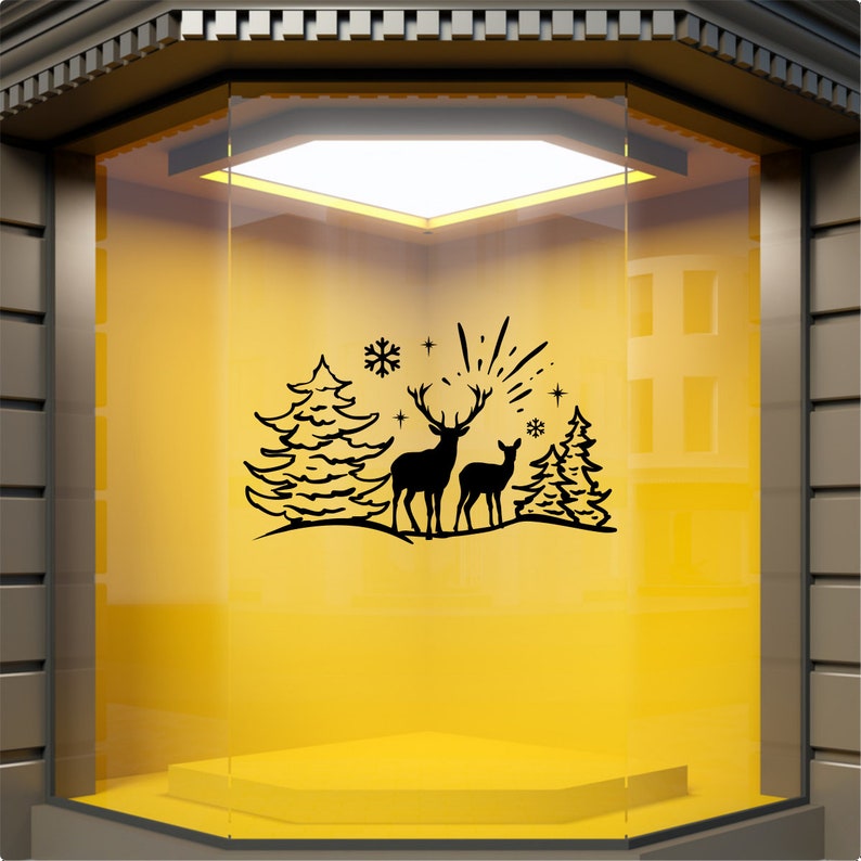 Reindeer Christmas woodland scene decal displayed on a yellow shop window