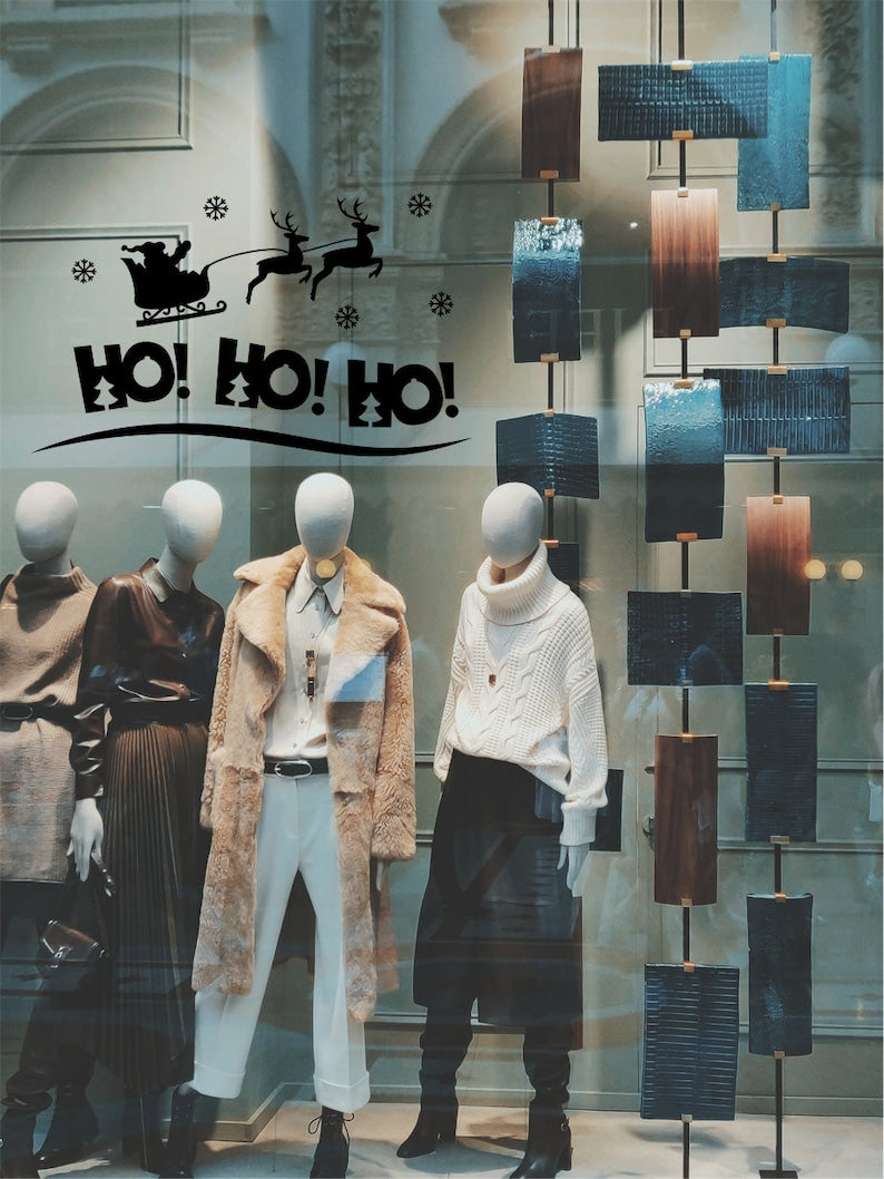 HO HO HO Santa sleigh vinyl decal decorating a Christmas retail window