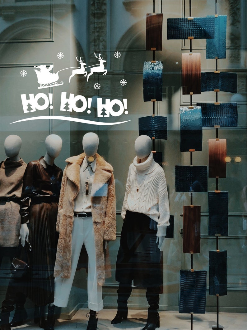 HO HO HO Santa and reindeer window sticker on a festive shop display